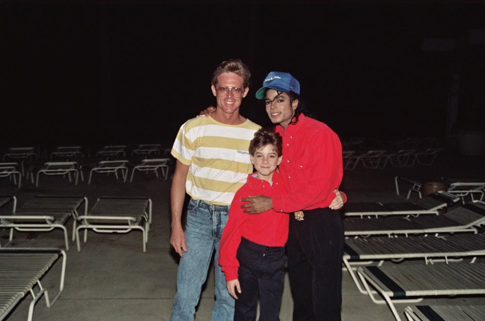 <p>Michael Jackson with James Safechuck (center), who alleges a pattern of sexual abuse by the late singer.&nbsp;</p>