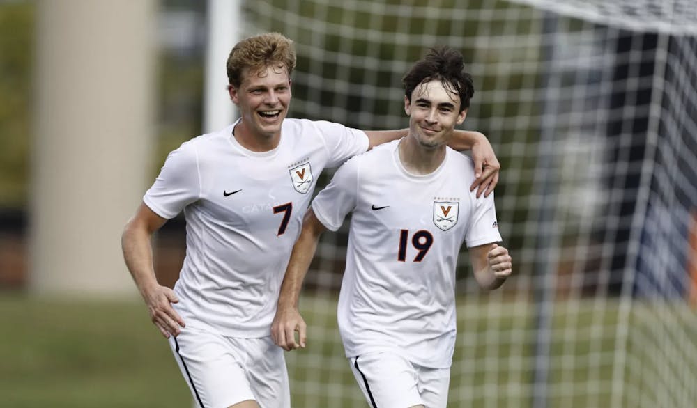 <p>Hayes Wood and Reese Miller after one of Virginia's five goals.</p>