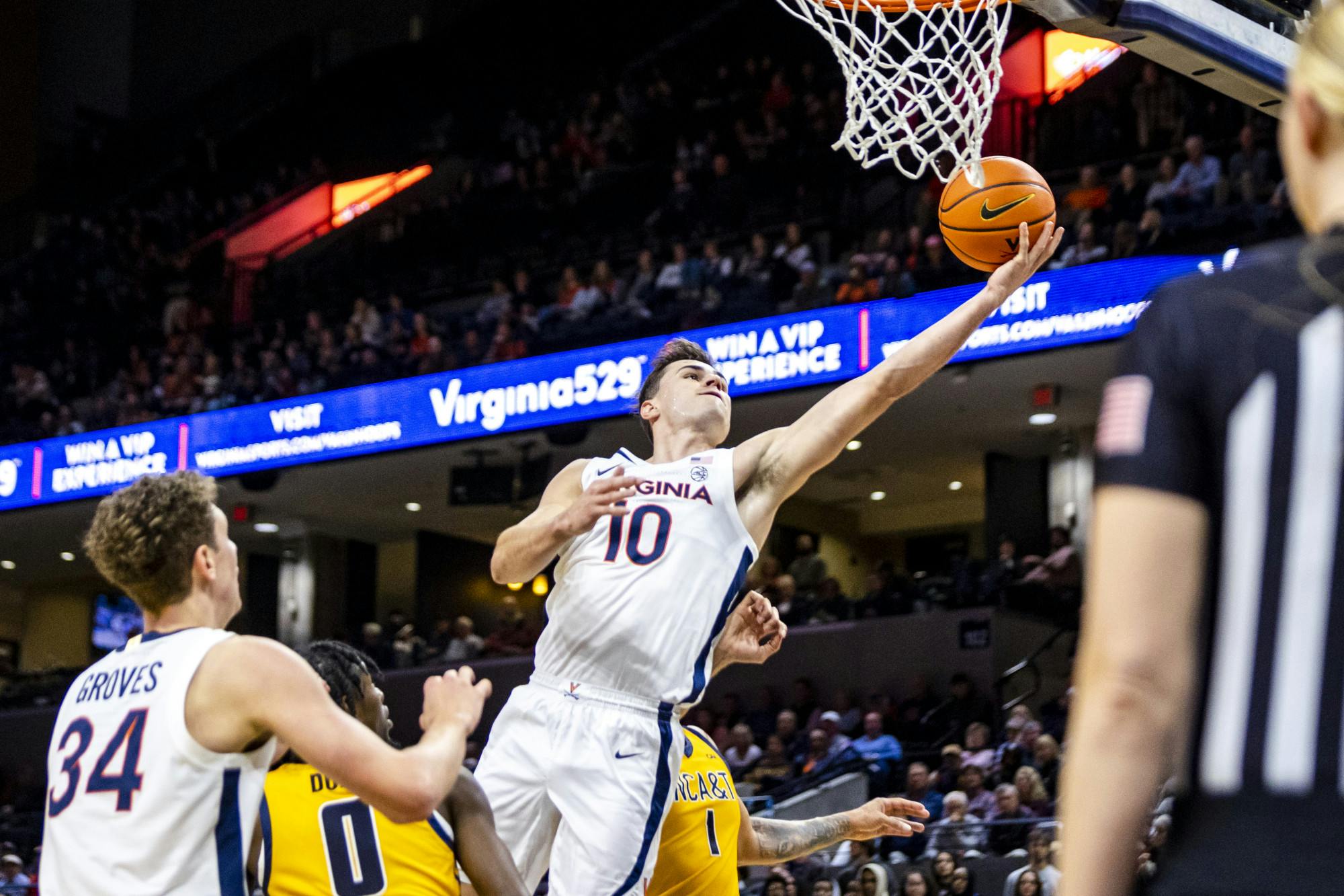 Junior wing Taine Murray drives to the hoop in the second half.