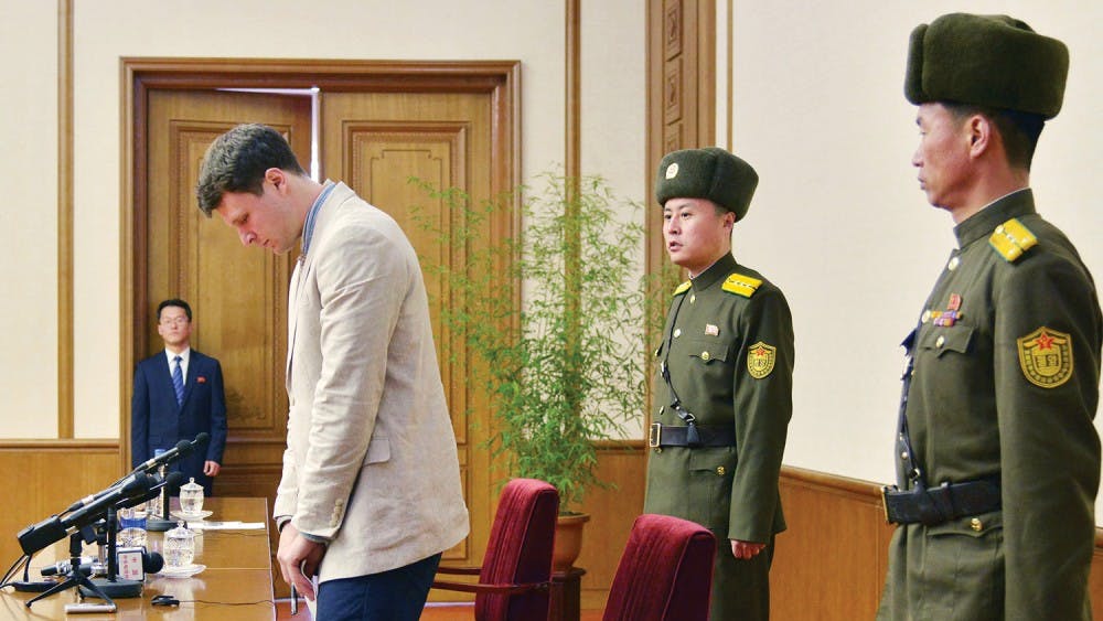Otto Frederick Warmbier (3rd R), a University of Virginia student who has been detained in North Korea since early January, attends a news conference in Pyongyang, North Korea, in this photo released by Kyodo February 29, 2016. Warmbier was detained for trying to steal a propaganda slogan from his Pyongyang hotel and has confessed to "severe crimes" against the state, the North's official media said on Monday. Warmbier, 21, was detained before boarding his flight to China over an unspecified incident at his hotel, his tour agency told Reuters in January. Mandatory credit REUTERS/Kyodo ATTENTION EDITORS - FOR EDITORIAL USE ONLY. NOT FOR SALE FOR MARKETING OR ADVERTISING CAMPAIGNS. THIS IMAGE HAS BEEN SUPPLIED BY A THIRD PARTY. IT IS DISTRIBUTED, EXACTLY AS RECEIVED BY REUTERS, AS A SERVICE TO CLIENTS. MANDATORY CREDIT. JAPAN OUT. NO COMMERCIAL OR EDITORIAL SALES IN JAPAN. - RTS8H5V