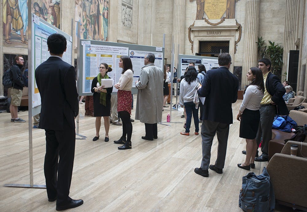 <p>Student researchers discussed their work with community members.</p>