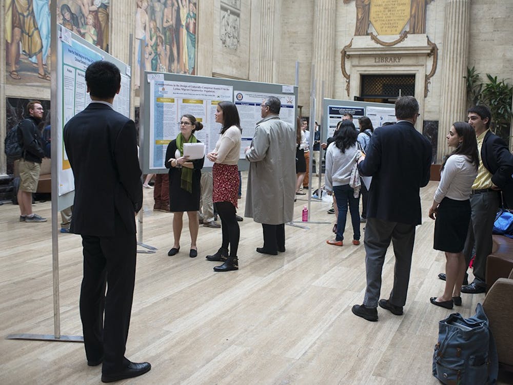 Student researchers discussed their work with community members.