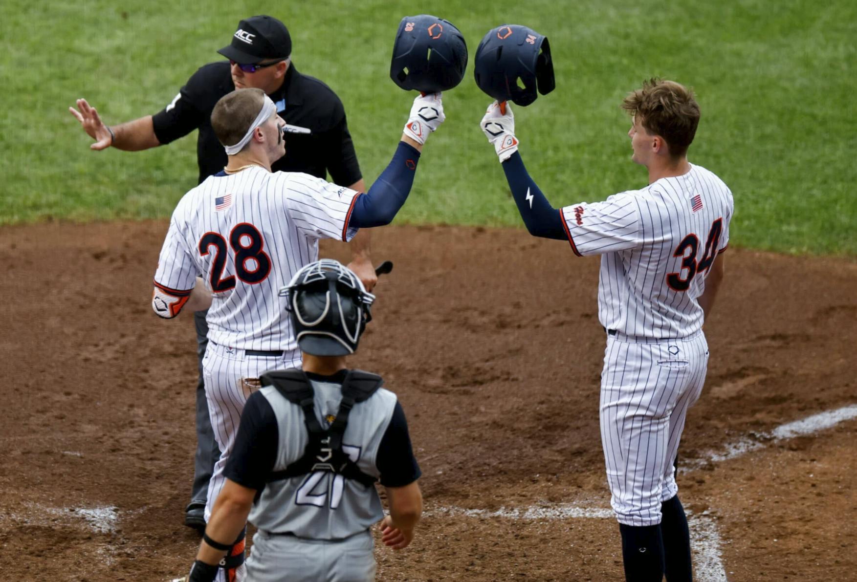 Jacob Ference and Harrison Didawick celebrate a home run.