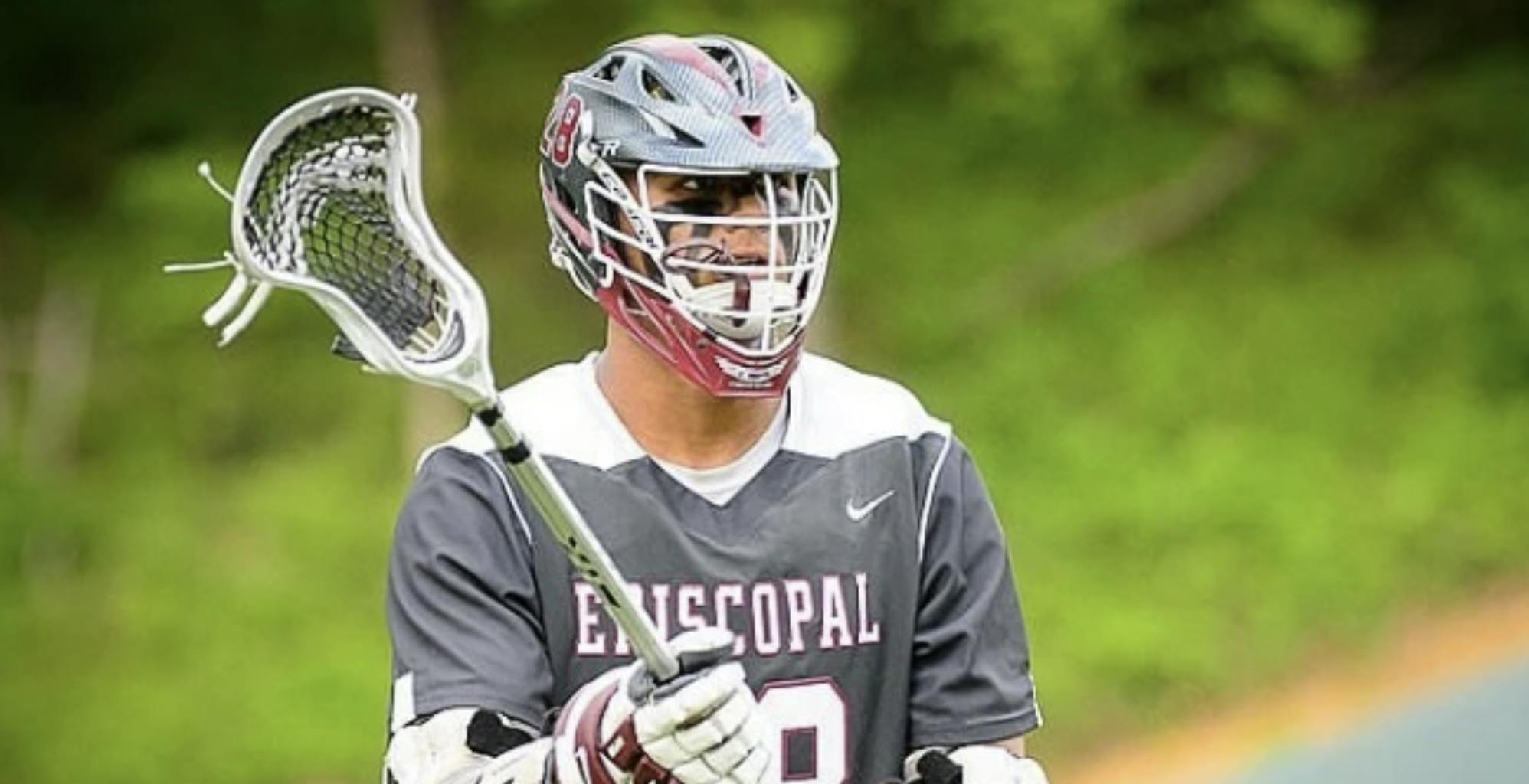 Miezan playing lacrosse back in high school.