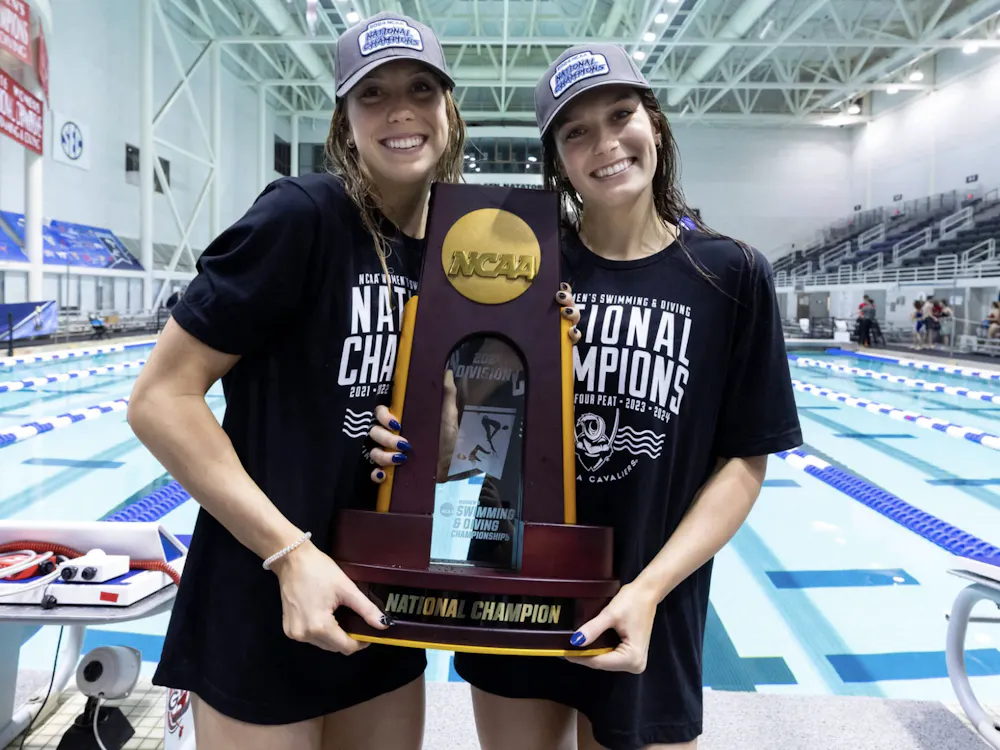 Alex and Gretchen Walsh pose with the 2024 National Championship trophy.