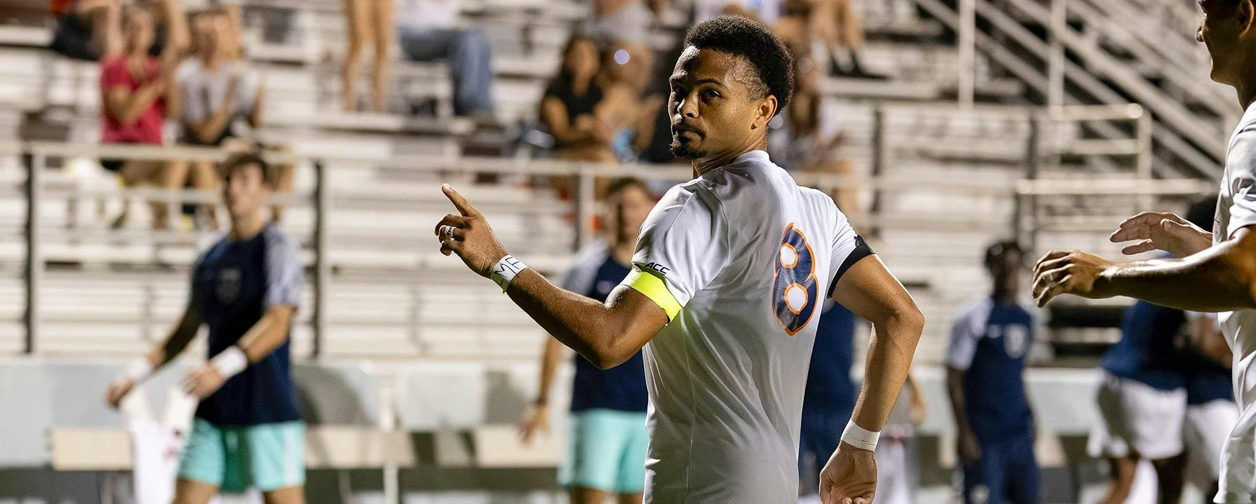 Brendan Lambe celebrates after his one-touch finish late in the second half equalized for the Cavaliers.