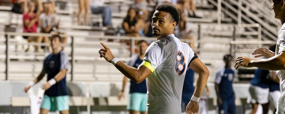 <p>Brendan Lambe celebrates after his one-touch finish late in the second half equalized for the Cavaliers.</p>