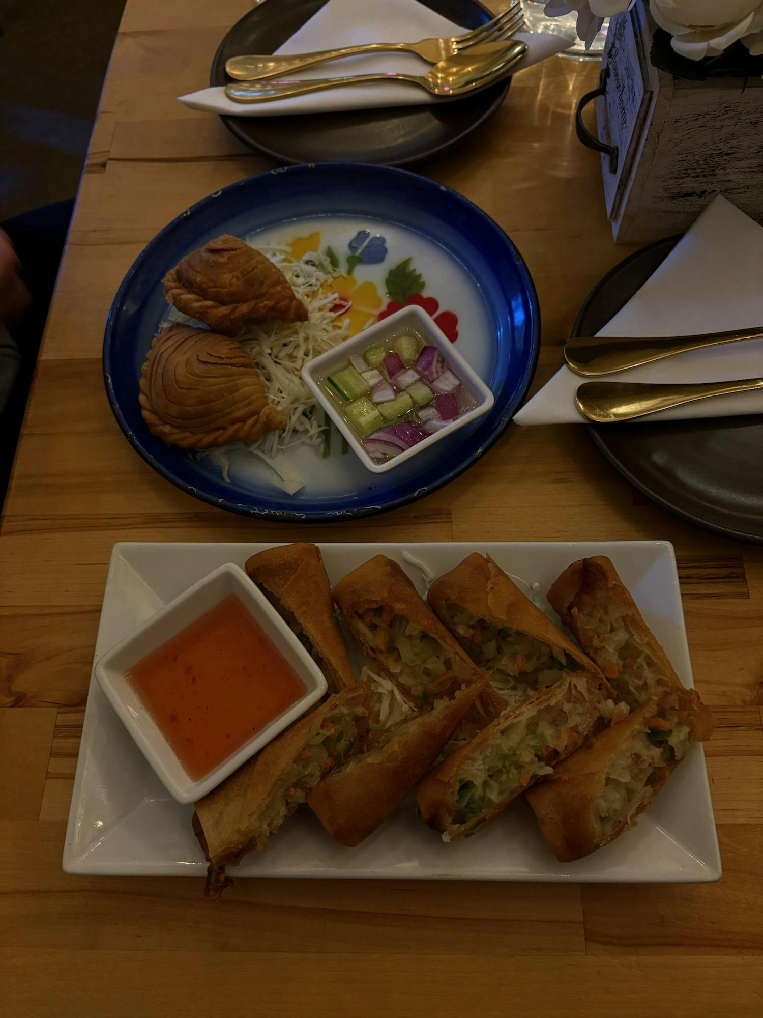 First up on our list of items are the two appetizers — the Fried Spring Rolls and the Thai Samosa.