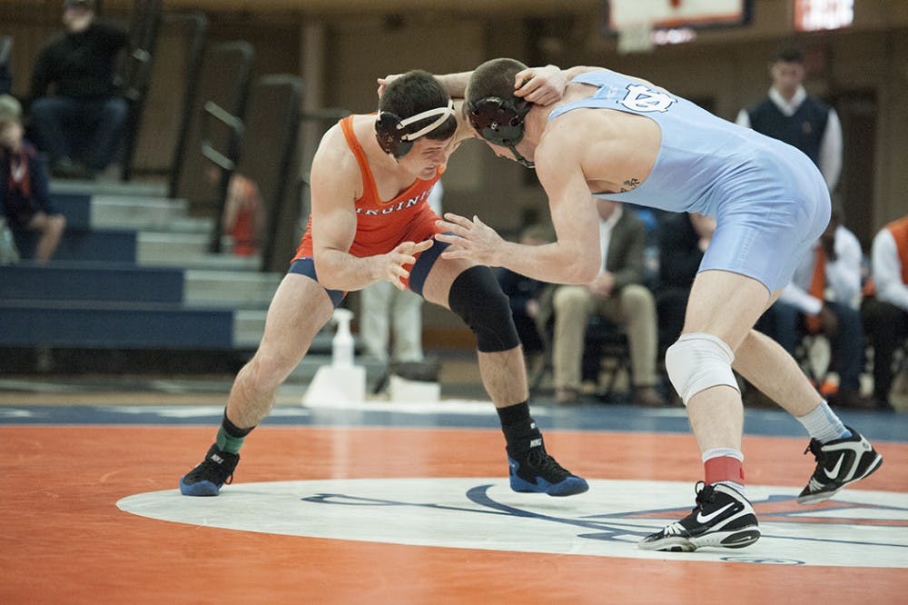 Virginia wrestling&nbsp;held a narrow 14-11 lead&nbsp;in Blacksburg before the Hokies' heavyweights rallied.&nbsp;