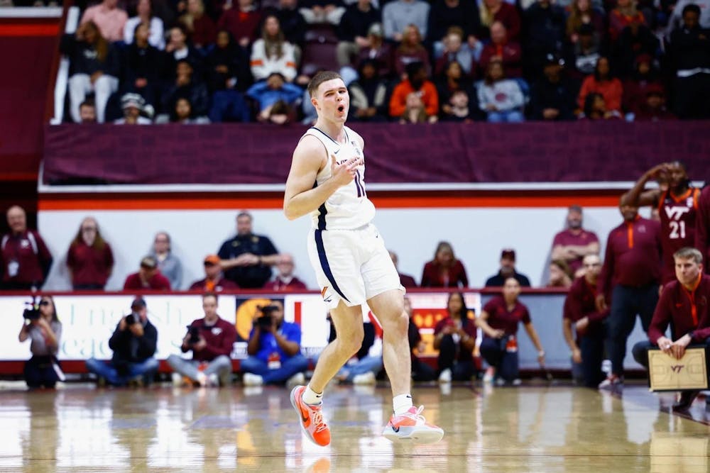 <p>Isaac McKneely dances back on defense after one his six three-pointers.</p>