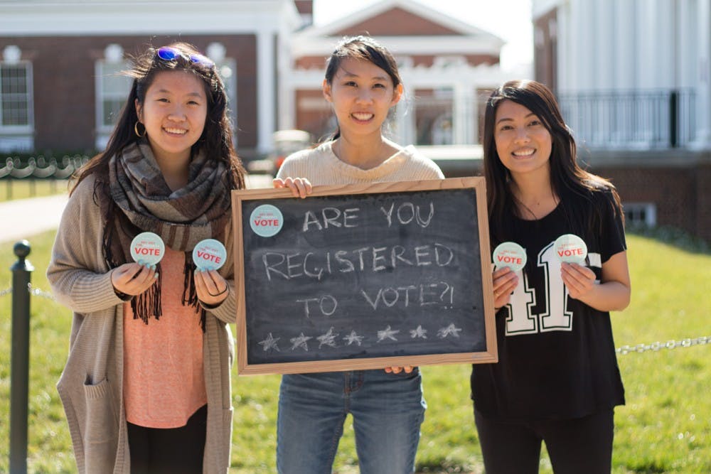 <p>Students have their pictures taken on the Lawn and explain why they chose to vote, and volunteers turn this picture along with the quote into a personalized Facebook profile picture.</p>