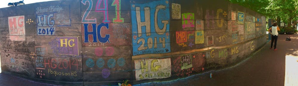 <p>The mural consists of a patchwork of “HG2014” emblems to resemble the pins given out after her disappearance.</p>