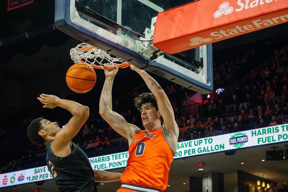 <p>Blake Buchanan hammers home a two-handed dunk.</p>