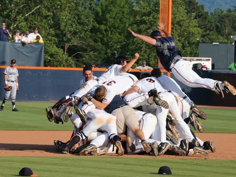 The Cavaliers dogpile after Clement's game-winner. 