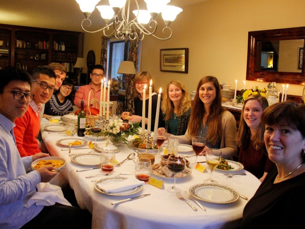 Prof. Dorothy Kelly hosting a Thanksgiving dinner as part of the Meal Match program in 2015.&nbsp;