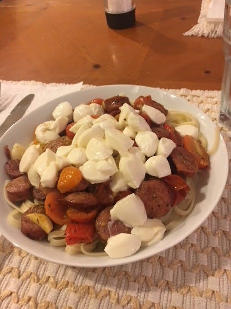 Linguini with sausage, tomatoes and fresh mozzarella.