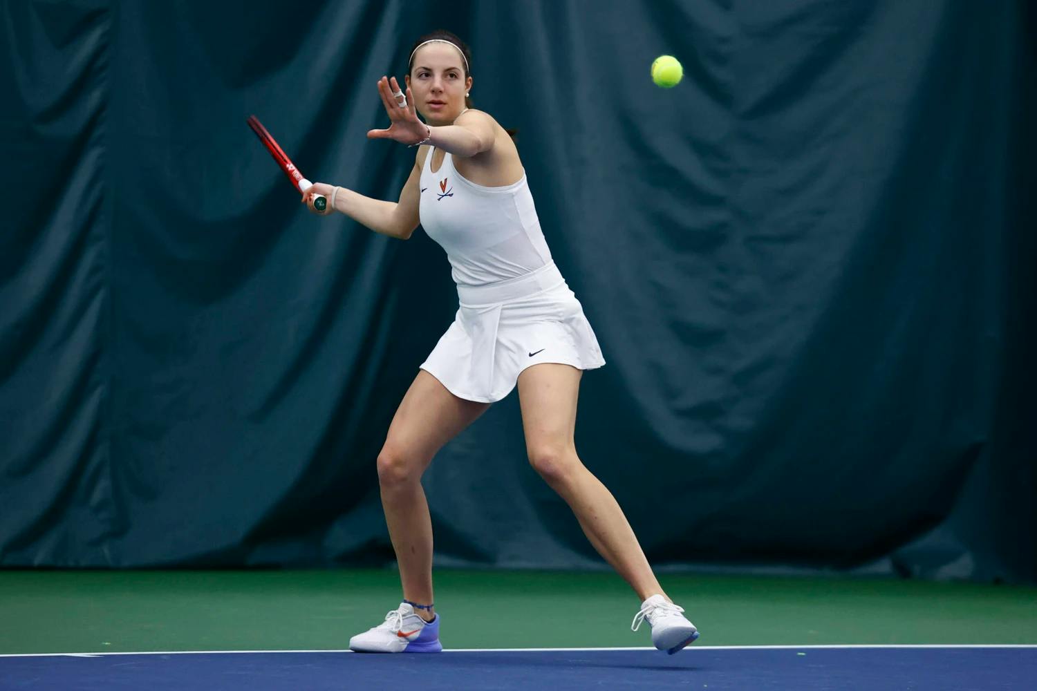 Ziodato winds up for a forehand.