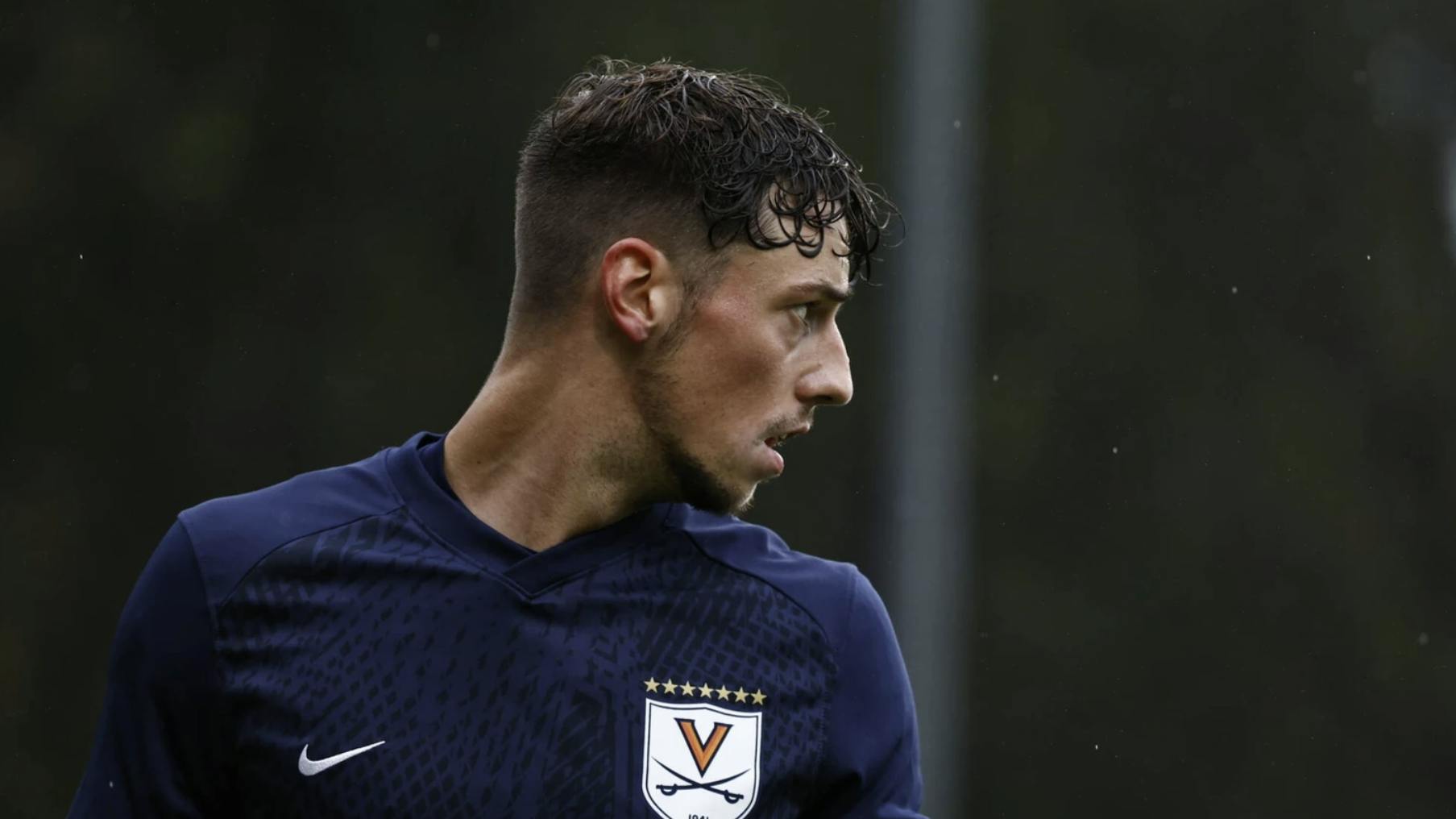 Senior defender Paul Wiese peers through the wet conditions.