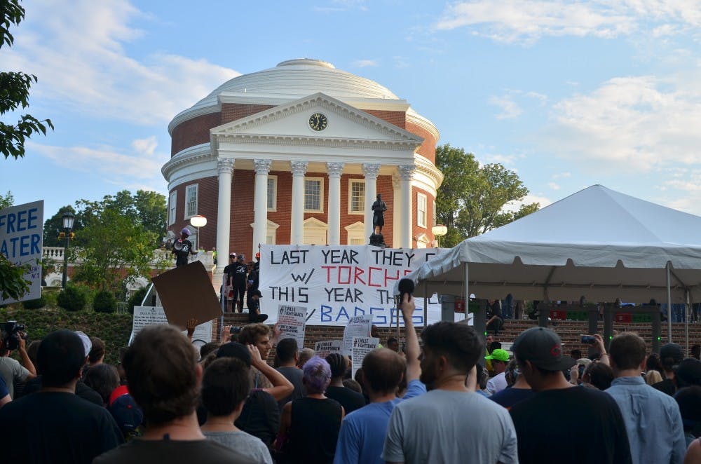 <p>Students and community members gathered in front of the Rotunda on the one-year anniversary of the torchlit white supremacist march of Aug. 11, 2017.</p>