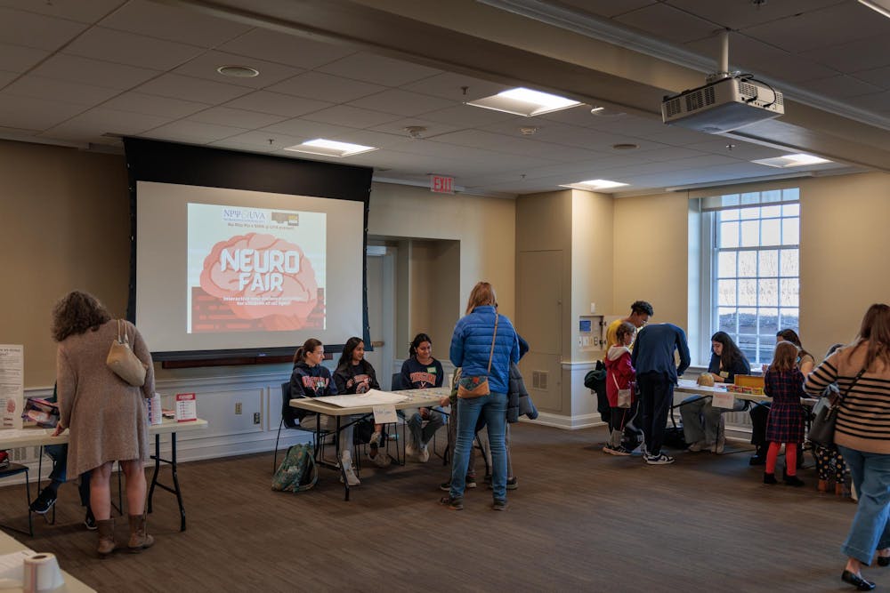 An art station offered crafts, such as creating a thinking cap that illustrates different parts of the brain and making neurons with pipe cleaners.