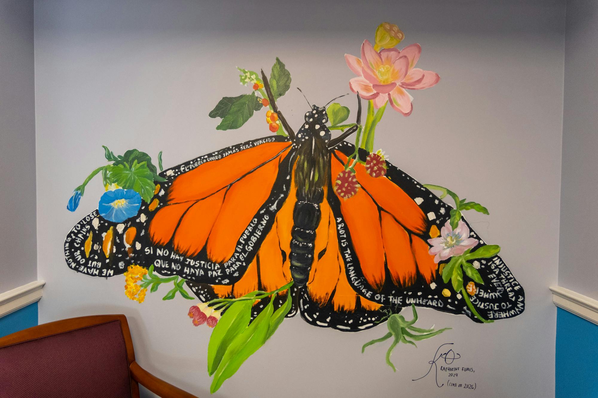 Throughout the month of February, Flores has worked tirelessly to design and paint the mural for the SLS office, drawing inspiration from her own complicated relationship with the American legal system after immigrating from El Salvador as a child.&nbsp;