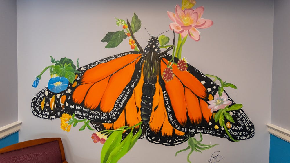 Throughout the month of February, Flores has worked tirelessly to design and paint the mural for the SLS office, drawing inspiration from her own complicated relationship with the American legal system after immigrating from El Salvador as a child. 