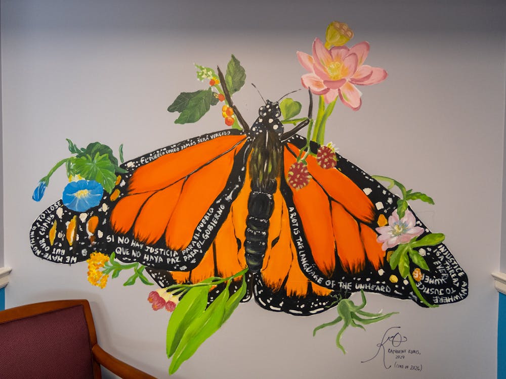 Throughout the month of February, Flores has worked tirelessly to design and paint the mural for the SLS office, drawing inspiration from her own complicated relationship with the American legal system after immigrating from El Salvador as a child. 