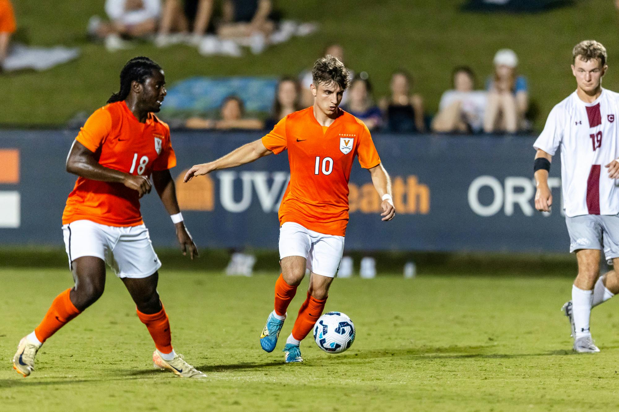 Virginia's Daniel Mangarov motors forward during the second half.