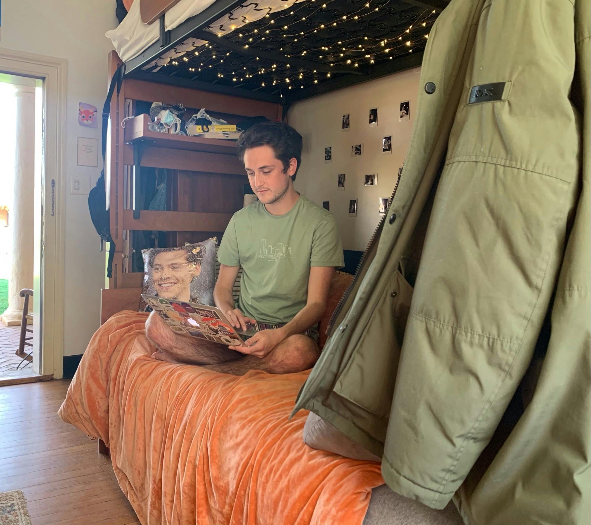 Jacob, a fourth-year lawn student, enjoys leaving his door open during a sunny day to study in his room.