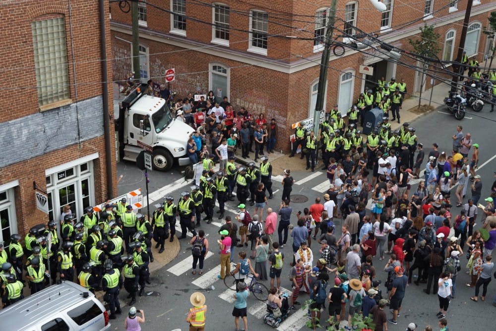 <p>There was tension between protesters and police Sunday at the intersection of Fourth Street and Water Street Sunday afternoon. This was the site of last year's car attack near the Downtown Mall.&nbsp;</p>