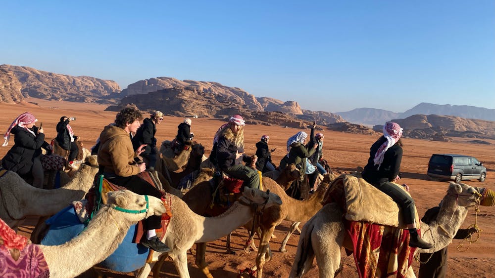 Students ride camels during last winter's U.Va. in Jordan trip.