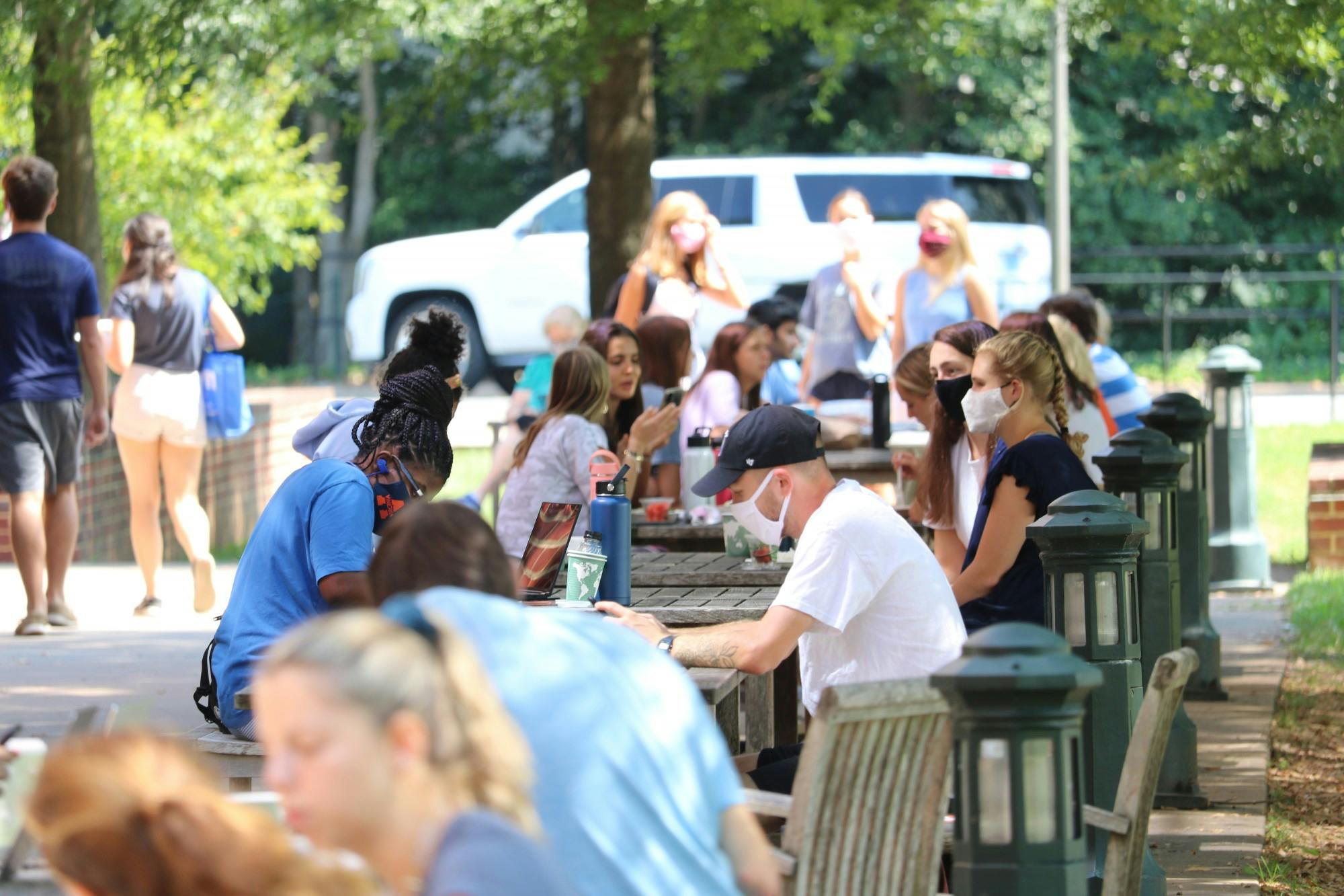 Many first-years, mostly masked, flocked outdoors after reaching Grounds.