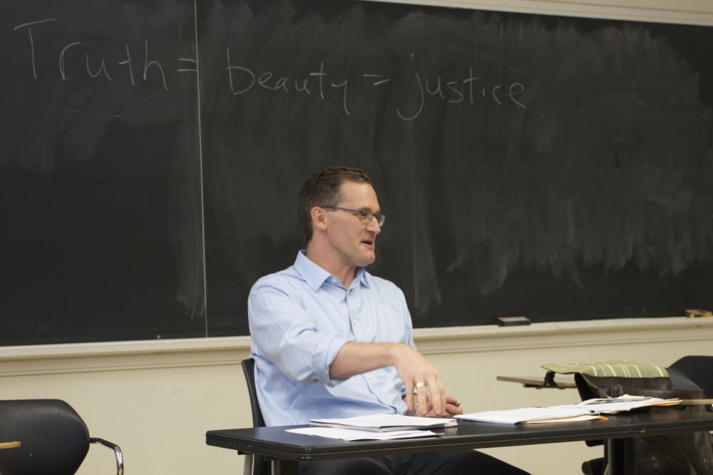 Charlottesville Mayor Mike Signer teaching his graduate-level politics class at the University of Virginia.
