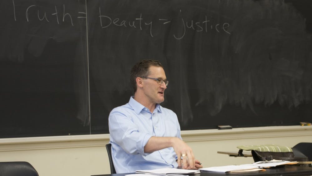 Charlottesville Mayor Mike Signer teaching his graduate-level politics class at the University of Virginia.