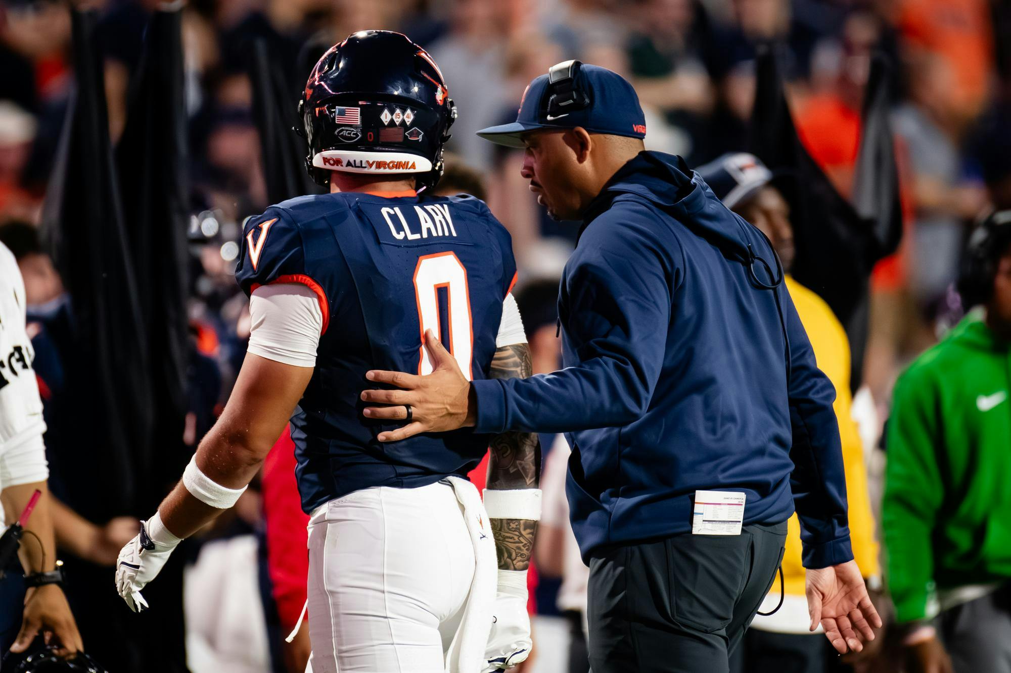 Elliott talks with Antonio Clary following his targeting ejection.