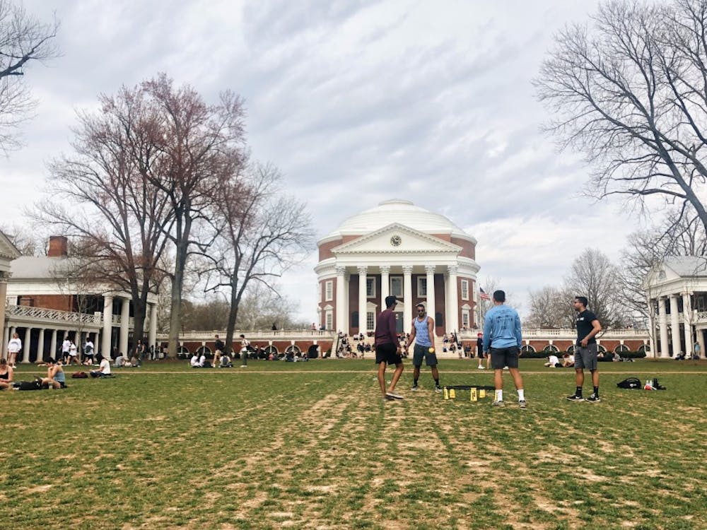 Students play spikeball on the Lawn on a spring afternoon. 