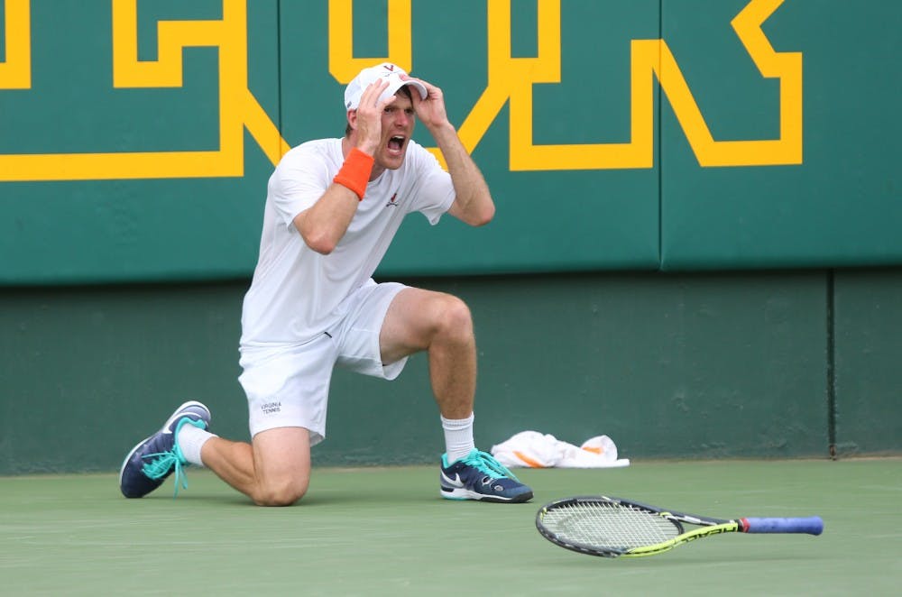 <p>Senior captain Mitchell Frank falls to his knees after clinching the match against Oklahoma's Andrew Harris. </p>