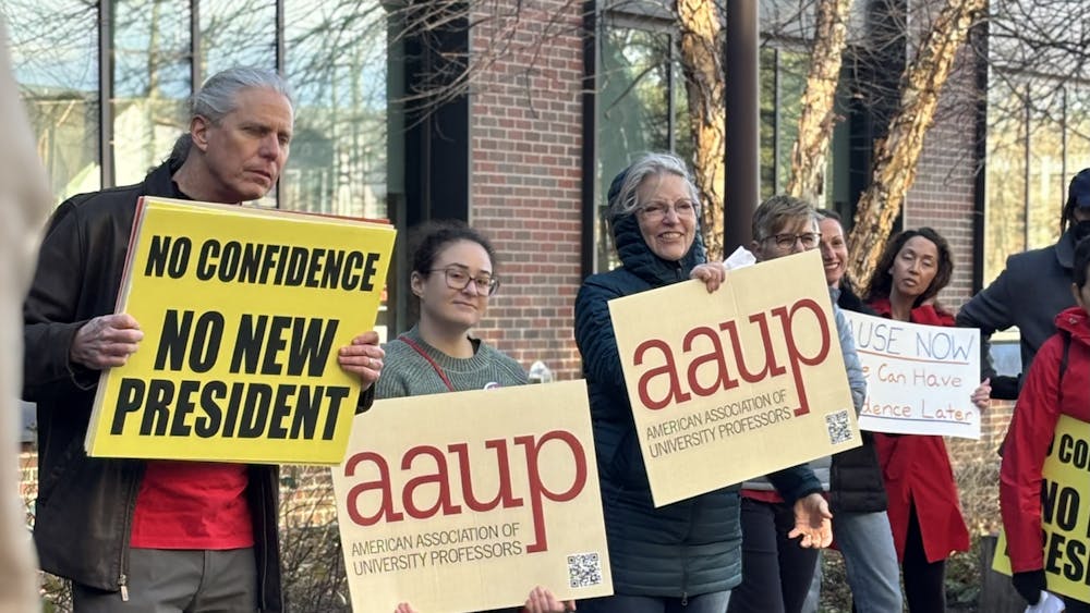 Protesters photographed outside of Board of Visitors meeting Friday