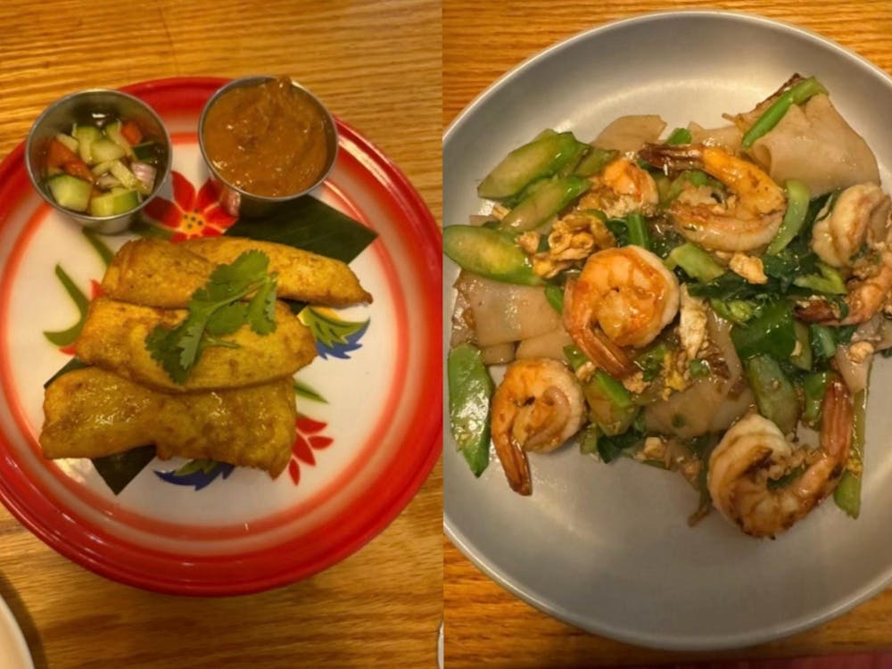Chicken satay left, shrimp pad see ew right.