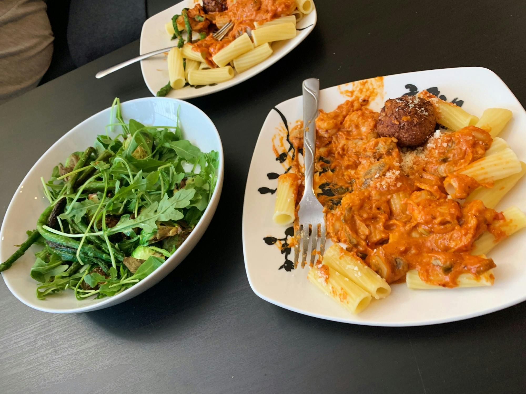 A colorful spread of greens and Gigi Hadid's famous vodka pasta create a feast for both your eyes and your stomach.