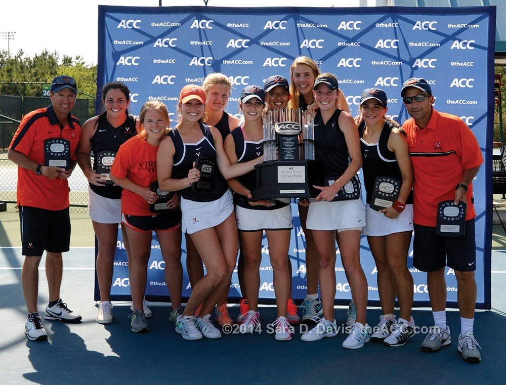 The Virginia women celebrate their  2014 ACC Women's Tennis Championship in Cary, N.C., April 27, 2014. Virginia won 4-2 over Duke. (Photo by Sara D. Davis, theACC.com)