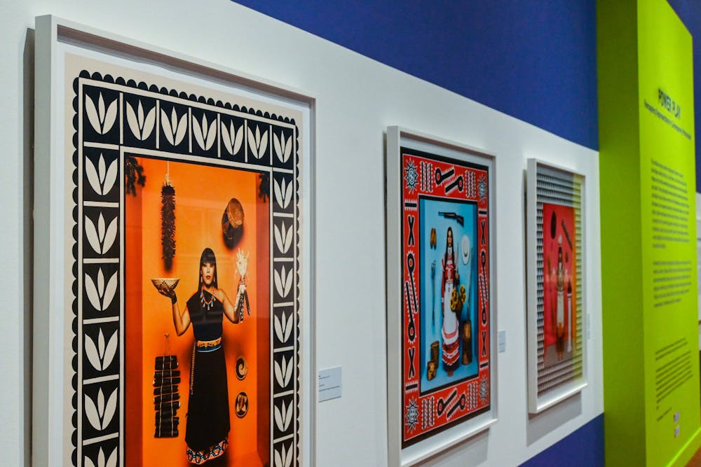 <p>Romero’s “First American Girl” series lies in the center of the exhibit, with three pieces that portray Native American women in traditional attire to critique stereotypical representations of Native culture in modern media.</p>