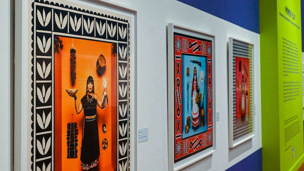 Romero’s “First American Girl” series lies in the center of the exhibit, with three pieces that portray Native American women in traditional attire to critique stereotypical representations of Native culture in modern media.