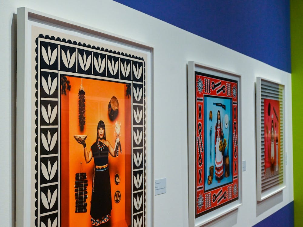 Romero’s “First American Girl” series lies in the center of the exhibit, with three pieces that portray Native American women in traditional attire to critique stereotypical representations of Native culture in modern media.