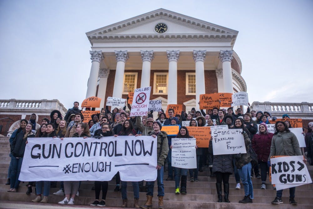 <p>The group made its way up McCormick Road to the Rotunda. Numerous participants brought signs to the march.&nbsp;</p>