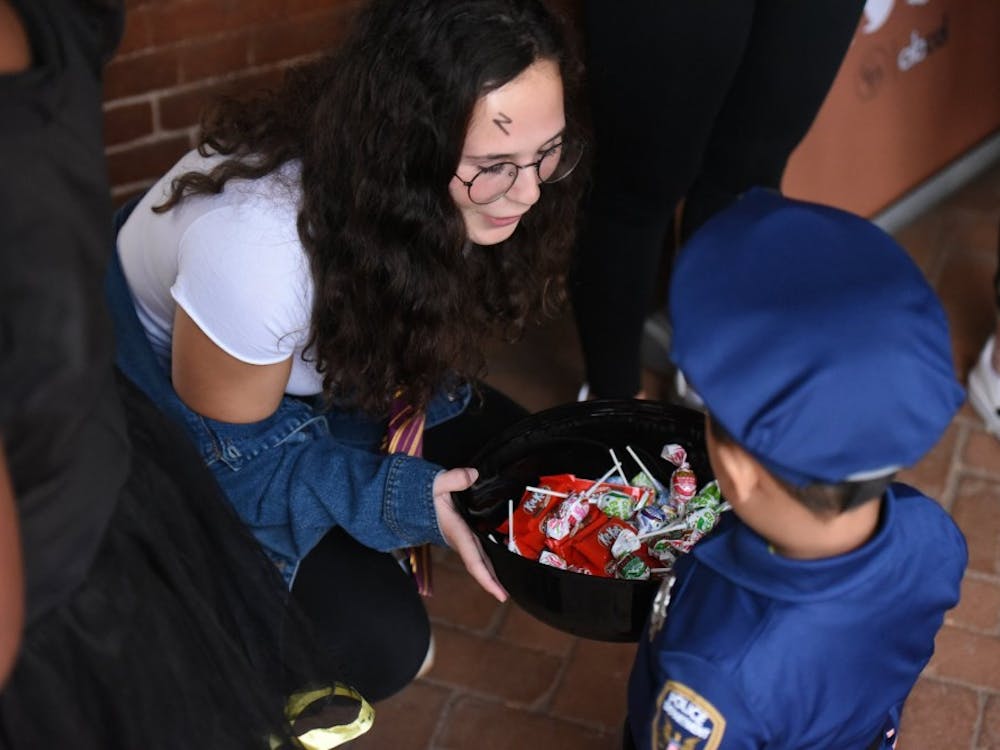 U.Va. students passed out candy to hundreds of children outside Lawn rooms. 