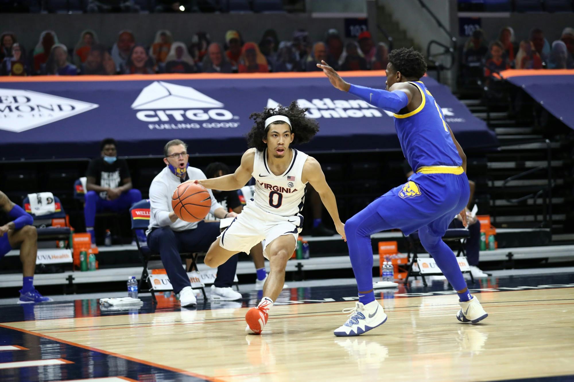 Virginia junior guard Kihei Clark is defended by Pittsburgh junior guard Xavier Johnson.