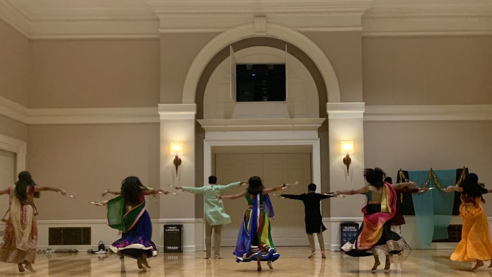 The ballroom was rife with sparkling chatter as attendees relished in delicious food and cheery company but was soon replaced with quiet awe as HooRaas — the University’s competitive co-ed dance team that specializes in garba — showcased a performance.&nbsp;