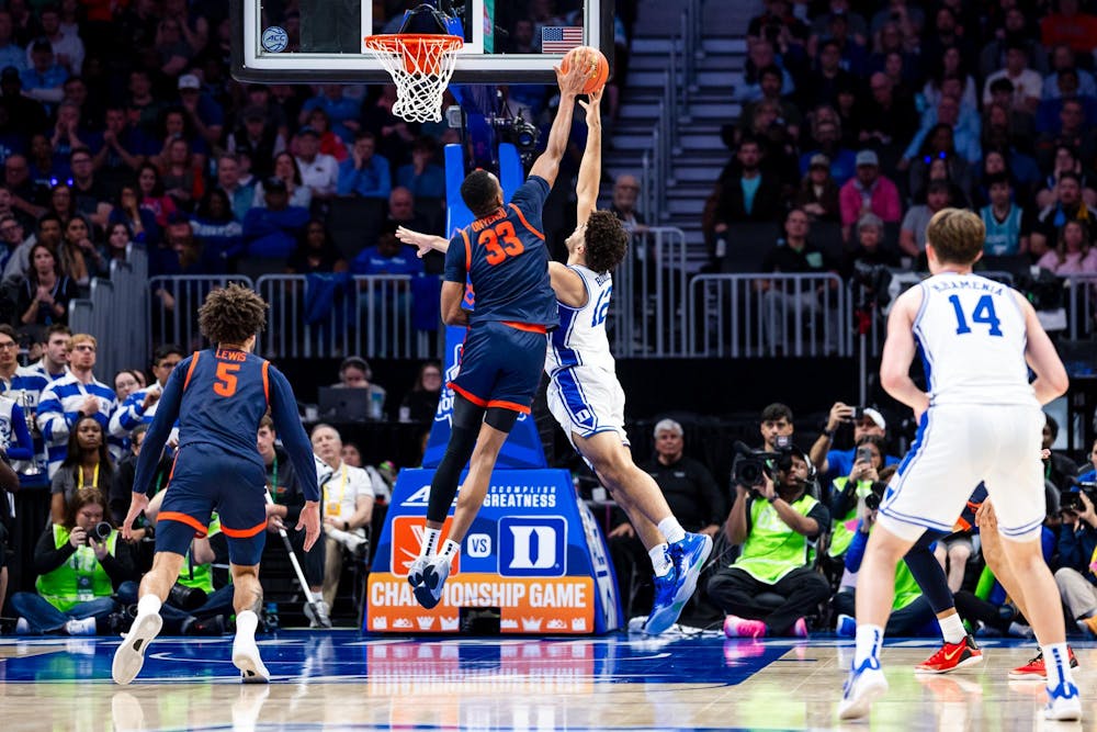 Ugonna Onyenso pictured blocking Duke's Cameron Boozer. 