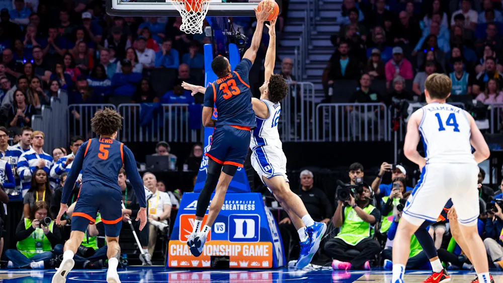 Ugonna Onyenso pictured blocking Duke's Cameron Boozer.
